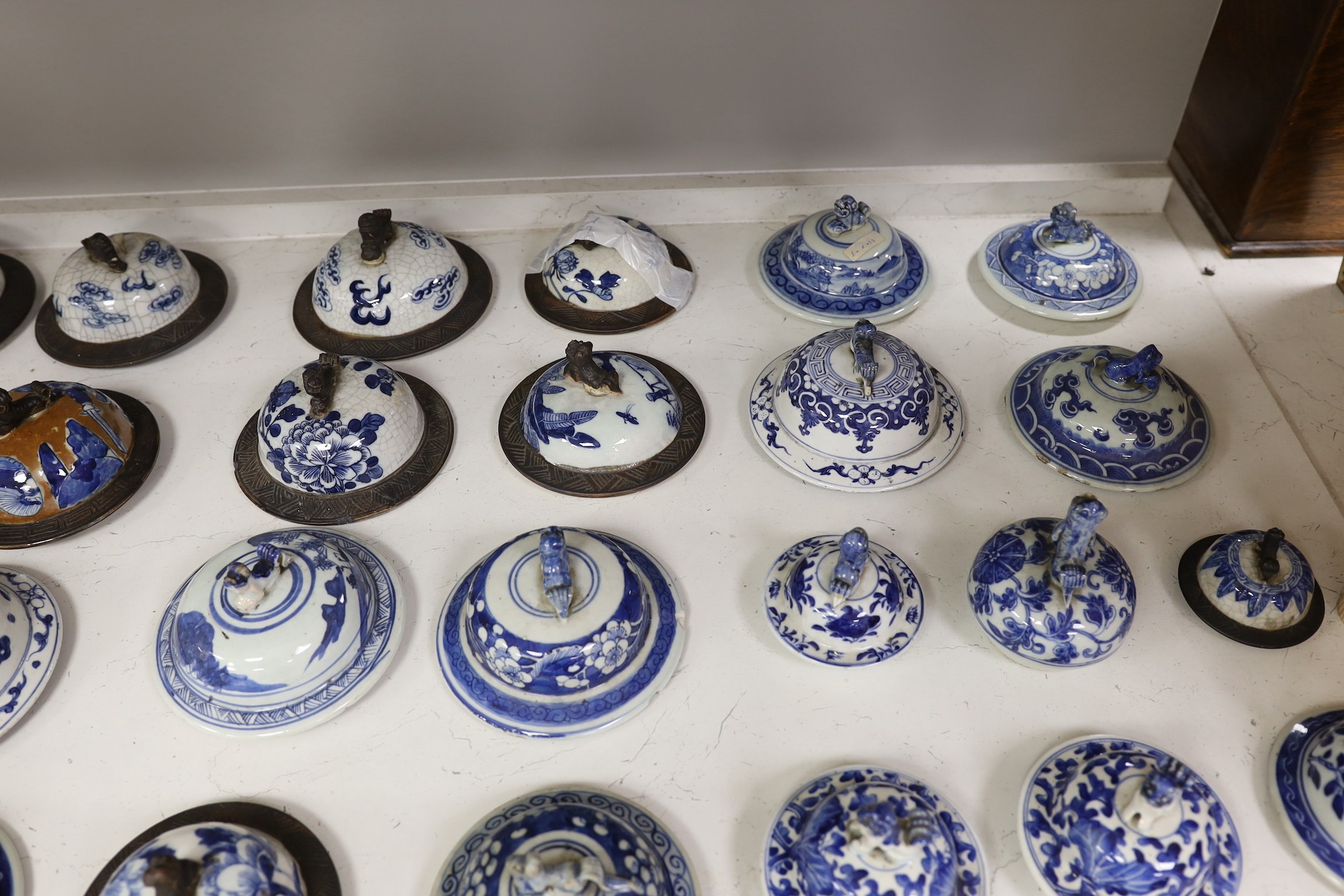 Thirty-seven 18th/19th century Chinese blue and white porcelain covers, 17cm diameter, Provenance - D.C.Monk & Son, former dealers based in Kensington Church Street, London W8